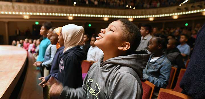 Several young children enjoy a concert
