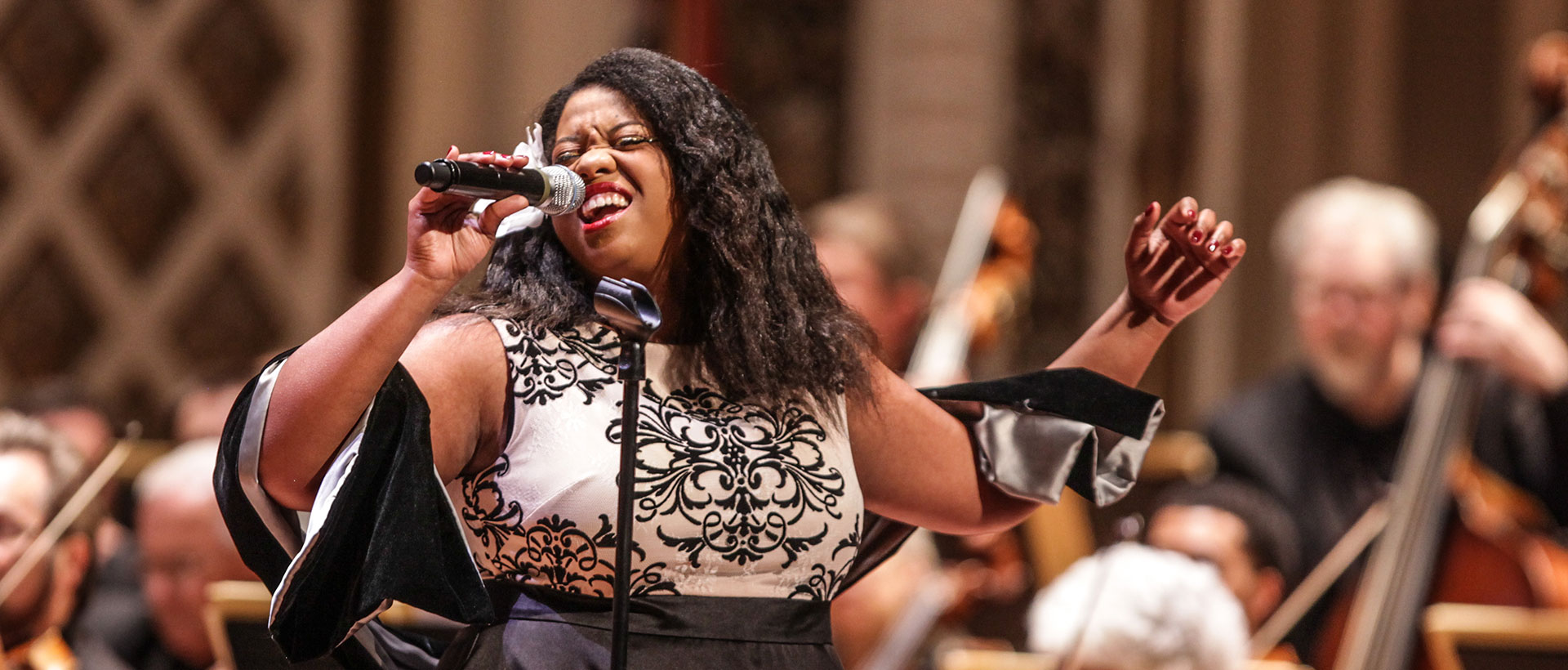 A female vocalist performs a song at a Classical Roots concert