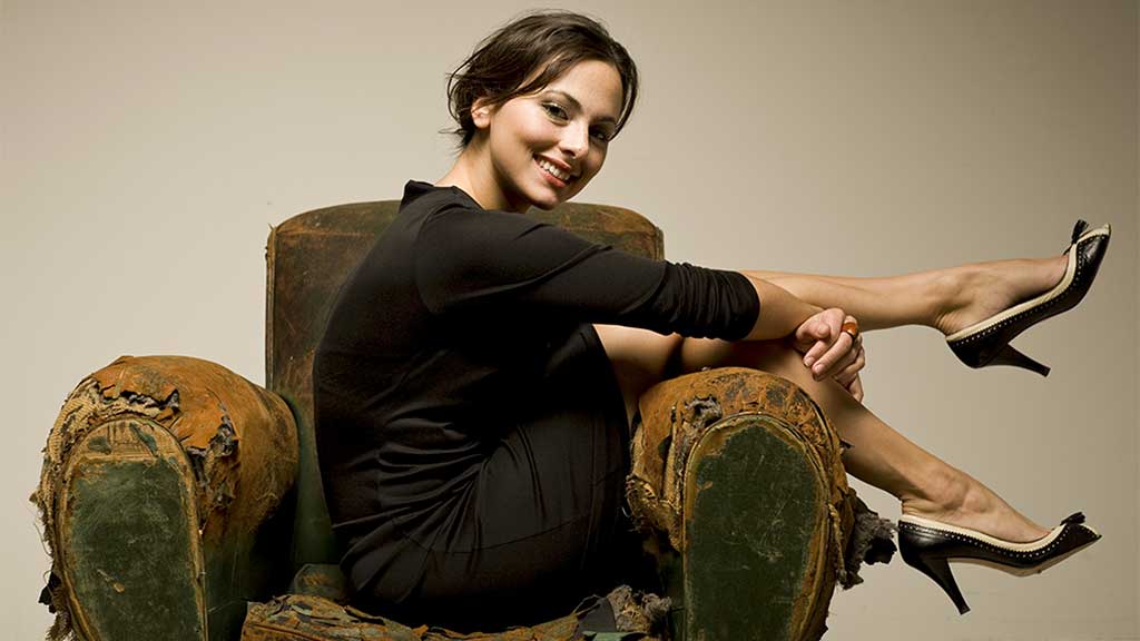 Soprano Isabel Leonard poses on a couch
